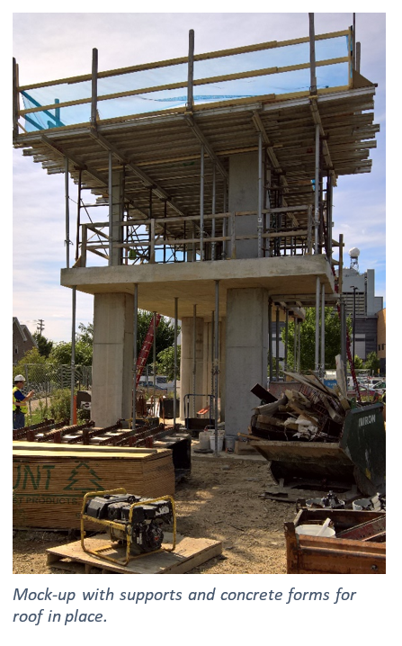 A tower rises above the construction site