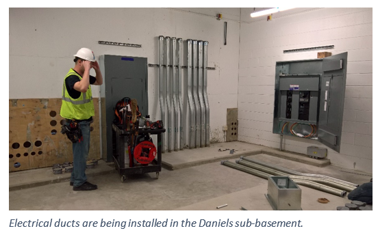 Man with hardhat in basement
