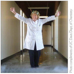 woman standing in hallway with arms lifted